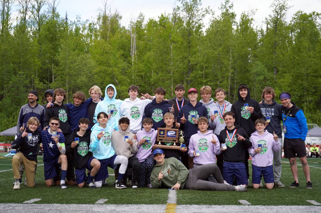 The Soldotna High School boys are awarded the state title after winning the ASAA Soccer Division II State Championships at Veterans Memorial Field in Wasilla, Alaska, on Saturday, May 25, 2024. (Jake Dye/Peninsula Clarion)