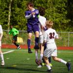 Soldotnas Zac Buckbee bounces a ball off his head during the ASAA Division II Soccer State Championships at Veterans Memorial Field in Wasilla, Alaska, on Saturday, May 25, 2024. (Jake Dye/Peninsula Clarion)