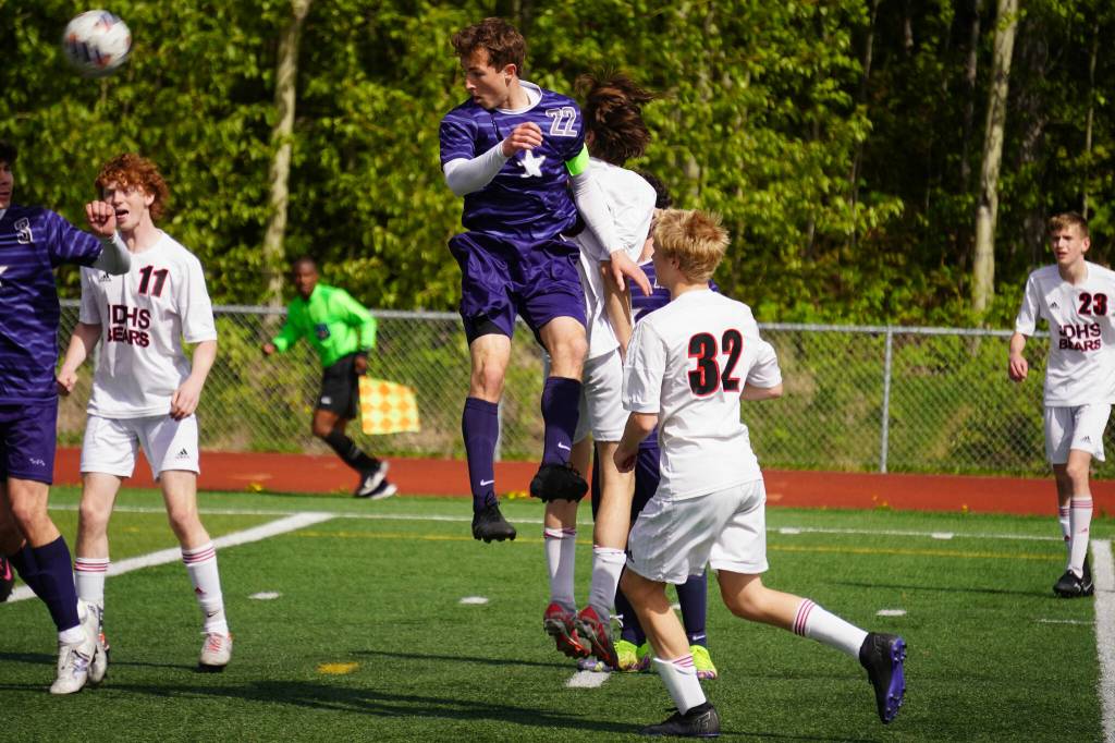 Soldotnas Zac Buckbee bounces a ball off his head during the ASAA Division II Soccer State Championships at Veterans Memorial Field in Wasilla, Alaska, on Saturday, May 25, 2024. (Jake Dye/Peninsula Clarion)