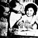 Ruth Ann and Oscar Pederson share smiles with young Vicky, a foster daughter they were trying to adopt in 1954. This front-page photograph appeared in the Fairbanks Daily News-Miner on June 17, 1954.