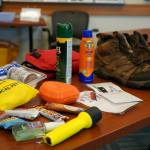 Hiking equipment is fills a table in a Trails and Hiking Discovery Room at the Kenai National Wildlife Refuge Visitors Center near Soldotna, Alaska, on Saturday, June 1, 2024. (Jake Dye/Peninsula Clarion)