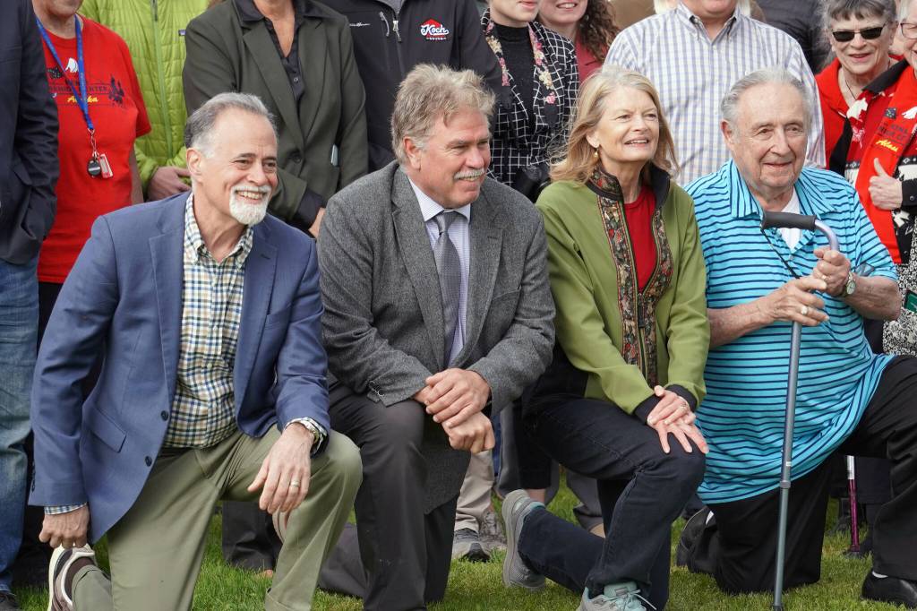Kenai Peninsula Borough Mayor Peter Micciche, City of Kenai Mayor Brian Gabriel, Sen. Lisa Murkowski and former City of Kenai Mayor John Williams gather for photos at the ribbon cutting for the Kenai River Bluff Stabilization Project on the bluff above the Kenai River in Kenai, Alaska, on Monday, June 10, 2024. (Jake Dye/Peninsula Clarion)