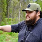 Jonathan Wilson leads a tour at the Kbeq Cultural Heritage Interpretive Site near Cooper Landing, Alaska, on Friday, June 7, 2024. (Jake Dye/Peninsula Clarion)
