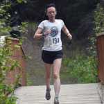 Morgan Ekemo runs to victory in the 5-kilometer race at the Run for the River on Saturday, June 8, 2024, in Soldotna, Alaska. (Photo by Jeff Helminiak/Peninsula Clarion)