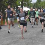 Lee Frey and Niko Zlotnik (501) lead the pack at the start of the 10-mile race at the Run for the River on Saturday, June 8, 2024, in Soldotna, Alaska. (Photo by Jeff Helminiak/Peninsula Clarion)
