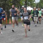 Lee Frey and Niko Zlotnik (501) lead the pack at the start of the 10-mile race at the Run for the River on Saturday, June 8, 2024, in Soldotna, Alaska. (Photo by Jeff Helminiak/Peninsula Clarion)