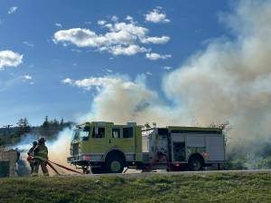 Homer Volunteer Fire Department works to extinguish an abandoned building on Lake Street on Friday, June 21, in Homer, Alaska. (Photo by Christina Whiting/courtesy)