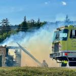 Homer Volunteer Fire Department works to extinguish an abandoned building on Lake Street on Friday, June 21, in Homer, Alaska. (Photo by Christina Whiting/courtesy)