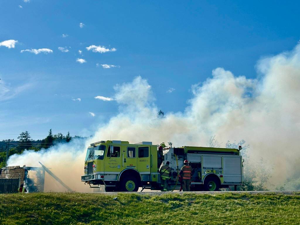 Homer Volunteer Fire Department works to extinguish an abandoned building on Lake Street on Friday, June 21, in Homer, Alaska. (Photo by Christina Whiting/courtesy)