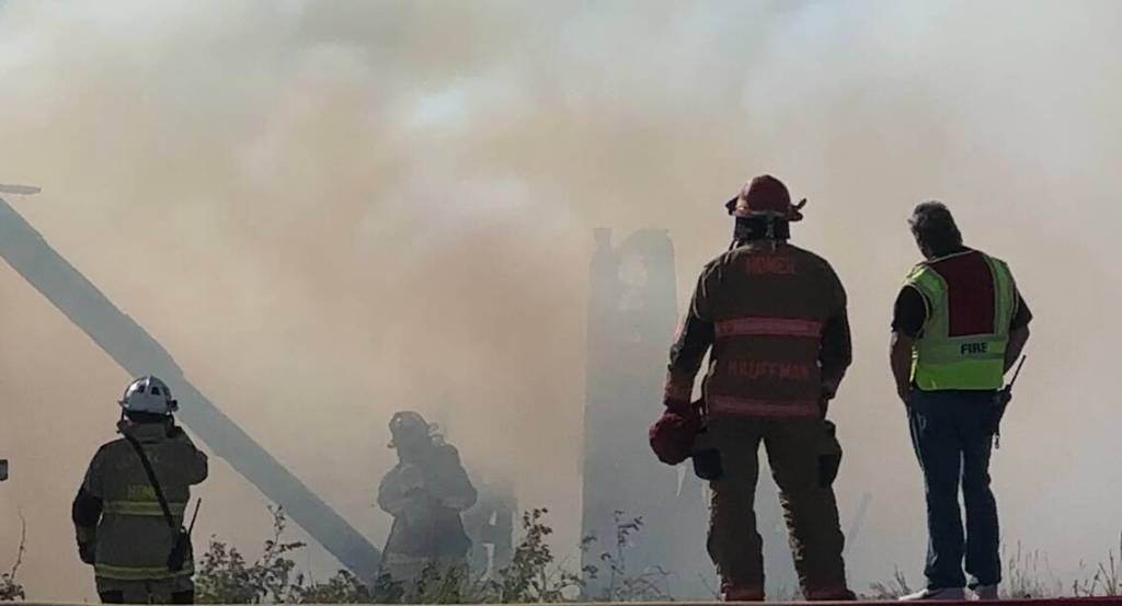Homer Volunteer Fire Department works to extinguish an abandoned building on Lake Street on Friday, June 21, in Homer, Alaska. (Photo by Christina Whiting/courtesy)
