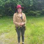 Emilie Springer/ Homer News
Carla Klinker poses with a long nettle stalk at the Homer News office on June 22, 2024.