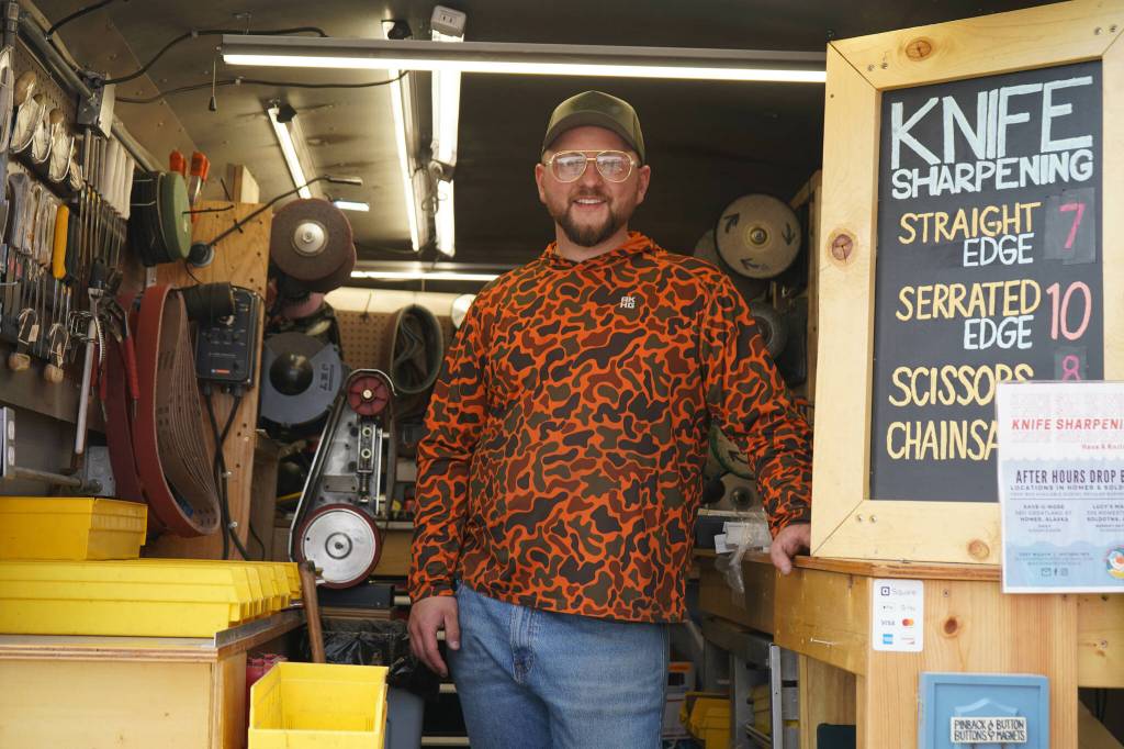 Grey Wilson, of Wilsons Proper Edge, stands for a photo at Soldotna Creek Park in Soldotna, Alaska, on Wednesday, June 19, 2024. (Jake Dye/Peninsula Clarion)