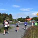 Runners jog down the Homer Spit Trail during the Homer Spit Run 10K to the Bay on Saturday, June 29, 2024, in Homer, Alaska. (Delcenia Cosman/Homer News)