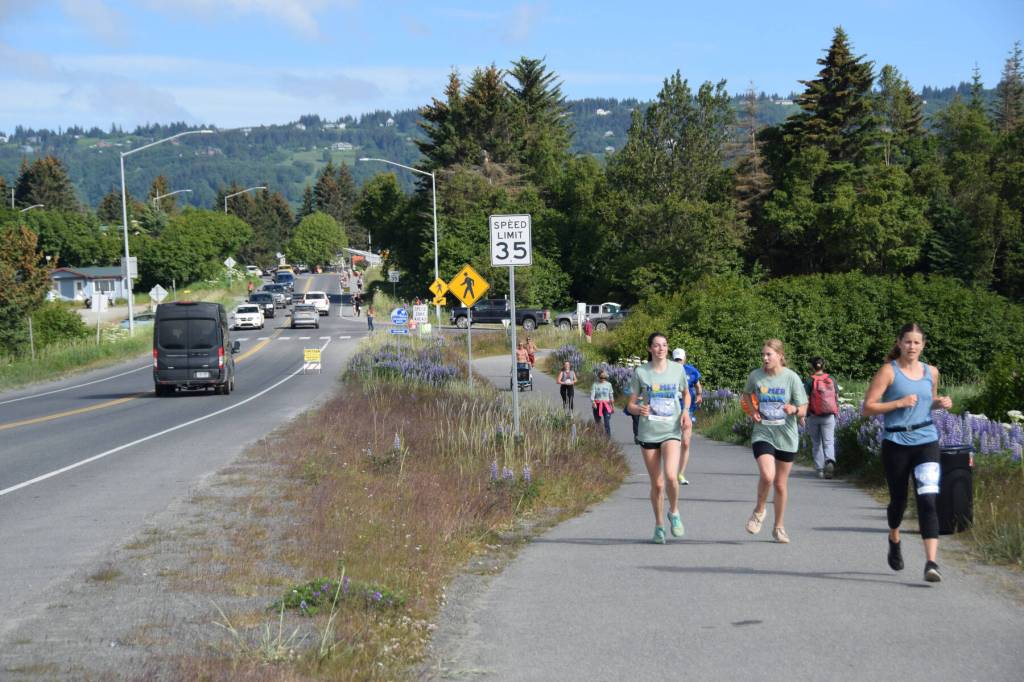 Runners make their way along the course, following Ocean Drive to the Homer Spit Trail and toward the finish line at Lands End Resort during the Homer Spit Run 10K to the Bay on Saturday, June 29, 2024, in Homer, Alaska. (Delcenia Cosman/Homer News)