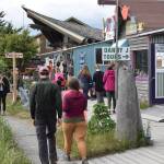 Visitors browse the shops along the Homer Spit on Friday, June 28, 2024, in Homer, Alaska. (Delcenia Cosman/Homer News)