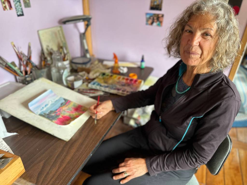 Homer artist Jan Peyton poses in her home studio on Monday, June 24, 2024, in Homer, Alaska. Photo by Christina Whiting