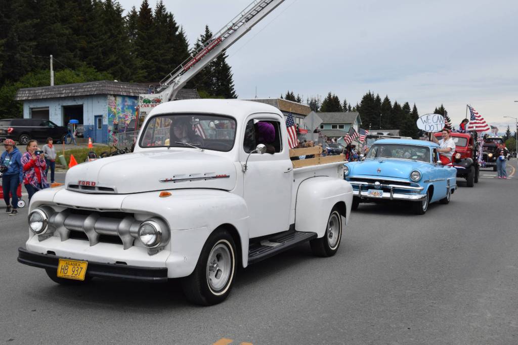 A line of antique cars proceeds down Pioneer Avenue during the Fourth of July parade on Thursday, July 4, 2024, in Homer, Alaska. (Delcenia Cosman/Homer News)