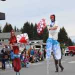 The Sealegs Stilt Troupe dances down Pioneer Avenue during the Fourth of July parade on Thursday, July 4, 2024, in Homer, Alaska. (Delcenia Cosman/Homer News)