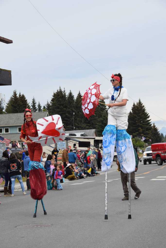 The Sealegs Stilt Troupe dances down Pioneer Avenue during the Fourth of July parade on Thursday, July 4, 2024, in Homer, Alaska. (Delcenia Cosman/Homer News)