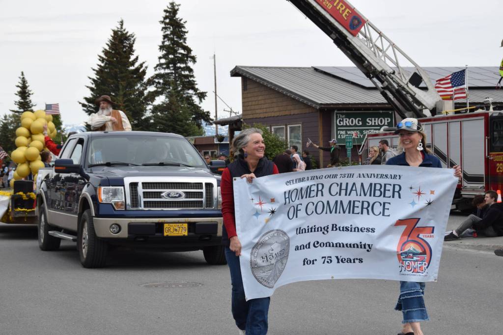 The Homer Chamber of Commerces float in the Fourth of July parade on Thursday, July 4, 2024, celebrates their 75th anniversary in Homer, Alaska, in the spirit of the parades theme, Historical Homer. The float carried parade grand marshal Homer Pennock, for whom the city is named, and advertised the chambers raffle for $75,000 in gold. (Delcenia Cosman/Homer News)
