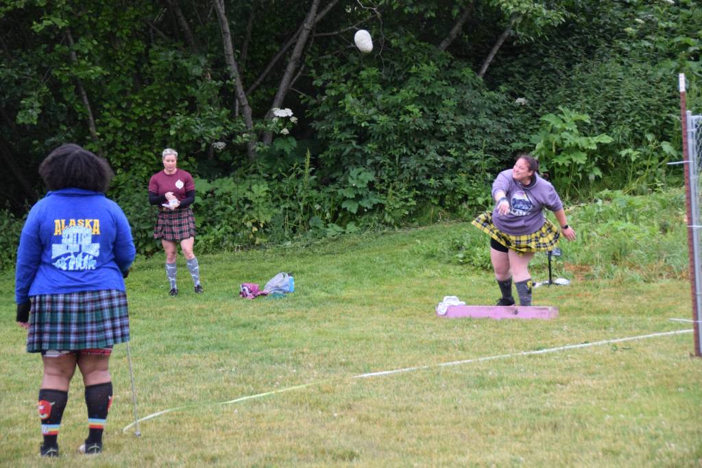 Sondra Willmann participates in the Braemar Stone Putt during the 12th annual Kachemak Bay Scottish Highland Games on Saturday, July 6, 2024, at Karen Hornaday Park in Homer, Alaska. (Delcenia Cosman/Homer News)