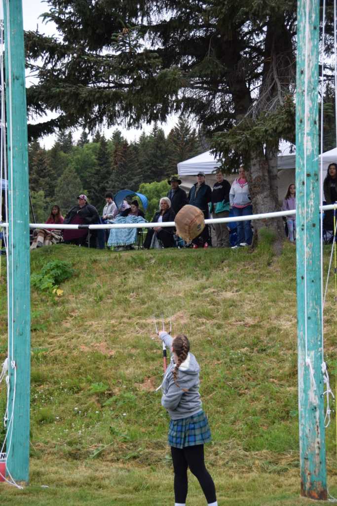 Maddie McClain tosses a sheaf over a raised crossbar during the 12th annual Kachemak Bay Scottish Highland Games on Saturday, July 6, 2024, at Karen Hornaday Park in Homer, Alaska. (Delcenia Cosman/Homer News)
