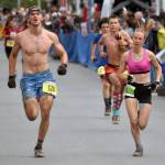 Kenais Tania Boonstra races Esters PJ Bragonier in the junior race at the Mount Marathon Race on Thursday, July 4, 2024, in Seward, Alaska. Boonstra was third in the girls race. (Photo by Jeff Helminiak/Peninsula Clarion)