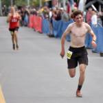 Palmers Coby Marvin outruns Anchorages Vebjorn Flagstad to win his third boys title at the Mount Marathon Race on Thursday, July 4, 2024, in Seward, Alaska. (Photo by Jeff Helminiak/Peninsula Clarion)