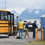 Passengers on the MS Westerdam disembark tour buses at Ramp 8 in the Homer Harbor before boarding the lifeboat that will take them back to the cruise ship on Friday, June 28, 2024, in Homer, Alaska. (Delcenia Cosman/Homer News)