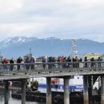 Passengers on the MS Westerdam wait in line to Ramp 8 in order to board the lifeboat that will take them back to the cruise ship on Friday, June 28, 2024, in Homer, Alaska. (Delcenia Cosman/Homer News)