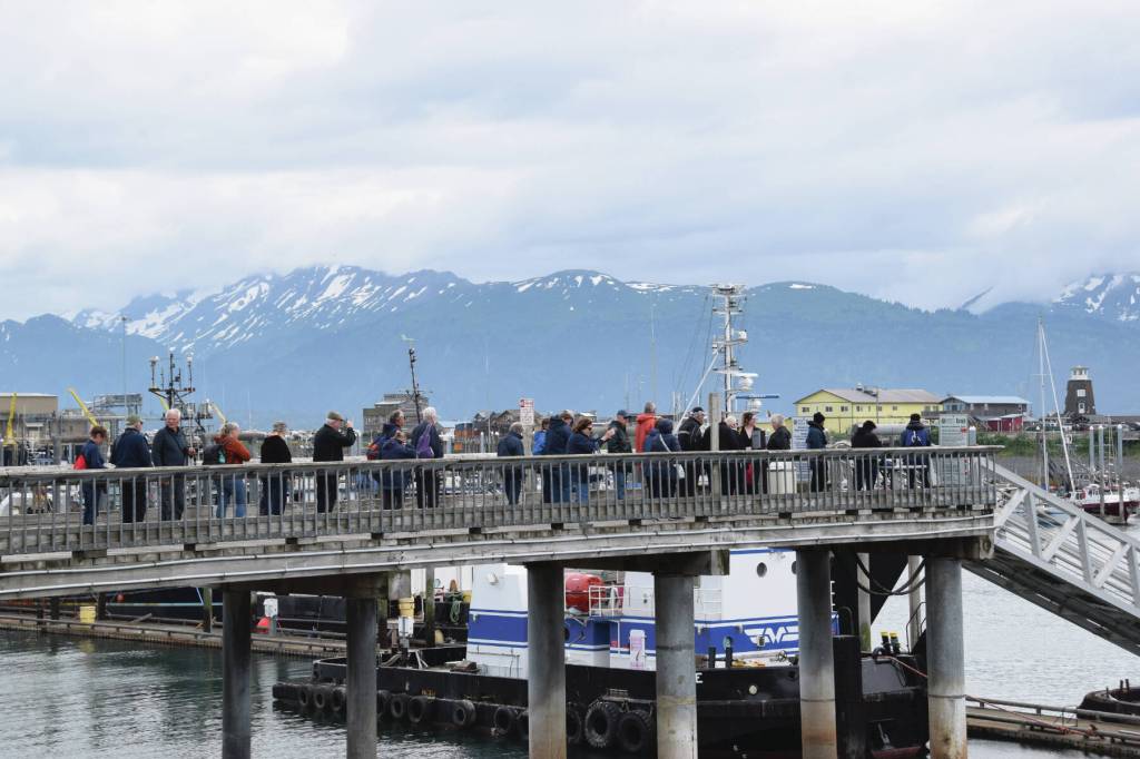 Passengers on the MS Westerdam wait in line to Ramp 8 in order to board the lifeboat that will take them back to the cruise ship on Friday, June 28, 2024, in Homer, Alaska. (Delcenia Cosman/Homer News)