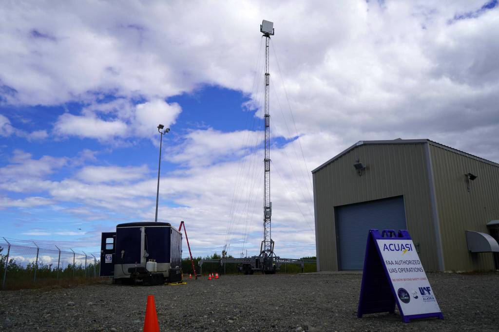 A radar stretches into the sky above a trailer and launch site for the test of beyond visual line of sight drone aircraft at Furie Operating Alaskas central processing facility in Nikiski, Alaska, on Wednesday, July 10, 2024. (Jake Dye/Peninsula Clarion)