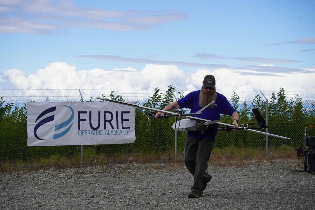Jason Williams readies a drone for takeoff before a test flight for the use of beyond visual line of sight drone aircraft, at Furie Operating Alaskas central processing facility in Nikiski, Alaska, on Wednesday, July 10, 2024. (Jake Dye/Peninsula Clarion)