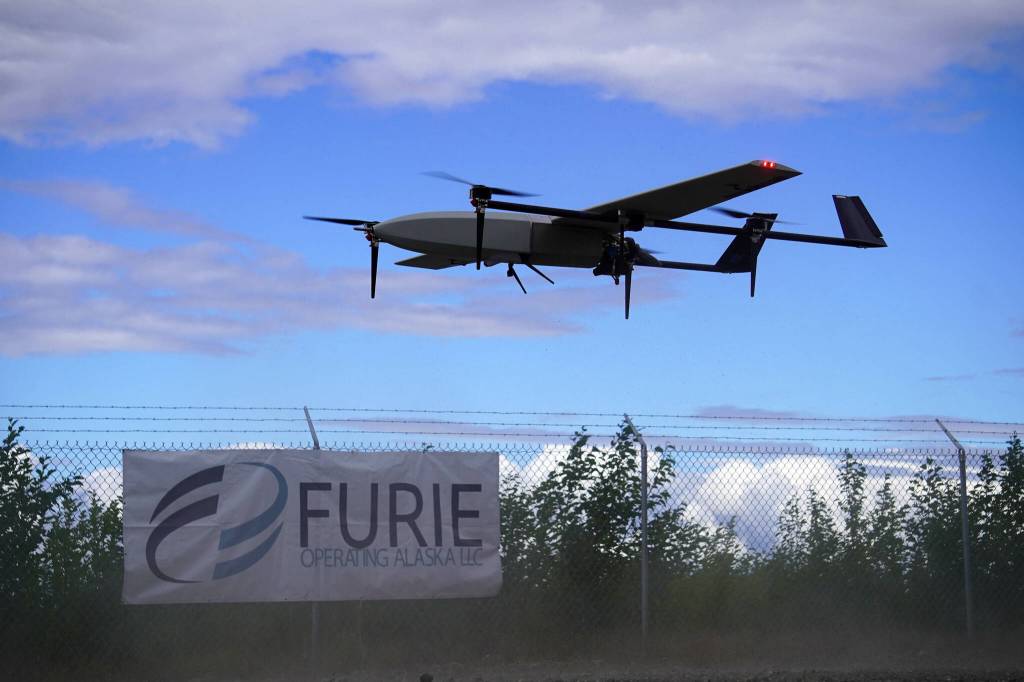 A drone rises into the air while kicking up dust, departing on a test flight for the use of beyond visual line of sight drone aircraft, at Furie Operating Alaskas central processing facility in Nikiski, Alaska, on Wednesday, July 10, 2024. (Jake Dye/Peninsula Clarion)