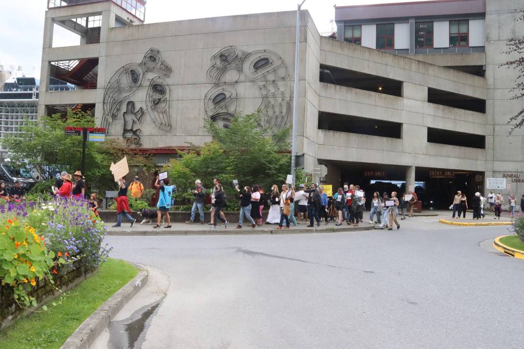 Two groups of protesters, after joining up at the downtown Juneau Public library, began walking through downtown streets on Sunday to protest the death of Steven Kissack last Monday. (Mark Sabbatini / Juneau Empire)