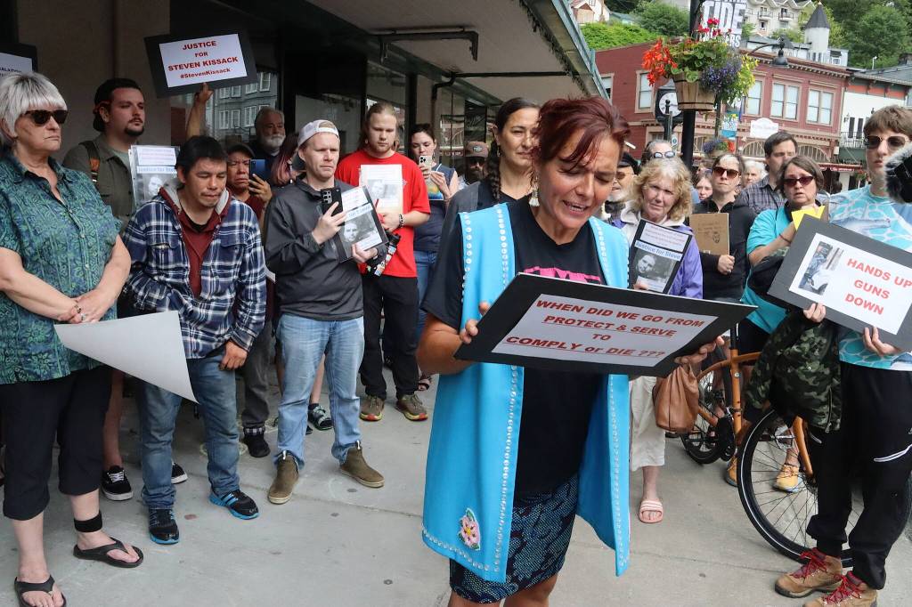 Rowena Brockway reads a letter from Steven Kissacks family to protesters on Sunday. (Mark Sabbatini / Juneau Empire)
