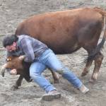 Troi Burnett competes in Chute Dogging at the third Soldotna Equestrian Association rodeo of the season Sunday, July 28, 2024, at the Soldotna Rodeo Grounds in Soldotna, Alaska. (Photo by Jeff Helminiak/Peninsula Clarion)