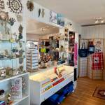 Art and merchandise, photographed on Wednesday, July 31, 2024, are available for sale at Diamond Ridge Gallery & Gifts, owned by Olga Amaral and located on the Homer Shores Boardwalk on the Spit in Homer, Alaska. Photo by Christina Whiting