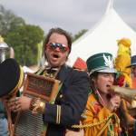 Members of the Salmonfest Marching Band parade through the fairgrounds at Salmonfest in Ninilchik, Alaska, on Saturday, Aug. 3, 2024. (Jake Dye/Peninsula Clarion)
