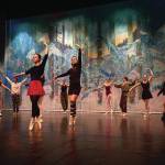 Left to right: Nutcracker ballet performers Aria Palma, Jaelynn Kennon, Tiya Martushev, Talli Dalke, Ireland Styvar, Sofia Loboy and Ella Gustafson rehearse the Snow dance onstage at the Homer High School Mariner Theatre on Sunday, Nov. 19, 2023, in Homer, Alaska. (Photo by Chris Kincaid/courtesy)