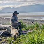 Homer artist Bonnie Dupree paints on the Homer Spit beach during the summer of 2023 in Homer, Alaska. Photo by Alice Porter