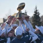 Soldotna hoists the First National Bowl on Saturday, Oct. 21, 2023, after the Division II championship game at Service High School in Anchorage, Alaska. (Photo by Jeff Helminiak/Peninsula Clarion)