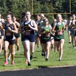 Homers Jaela Marchbanks (730) leads the junior-senior girls race onto the track Monday, Aug. 19, 2024, at the Peninsula Class Races at Nikiski Middle-High School in Nikiski, Alaska. (Photo by Jeff Helminiak/Peninsula Clarion)