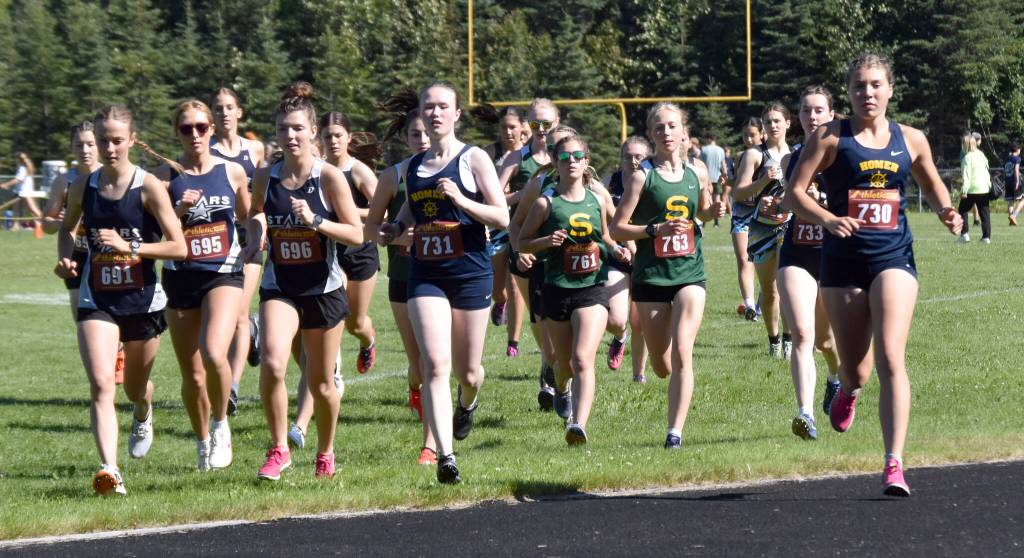 Homers Jaela Marchbanks (730) leads the junior-senior girls race onto the track Monday, Aug. 19, 2024, at the Peninsula Class Races at Nikiski Middle-High School in Nikiski, Alaska. (Photo by Jeff Helminiak/Peninsula Clarion)