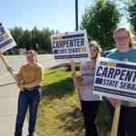 Supporters of Rep. Ben Carpenter, R-Nikiski, wave signs on the side of the Sterling Highway in Soldotna, Alaska, during the Alaska Primary Election Day on Tuesday, Aug. 20, 2024. (Jake Dye/Peninsula Clarion)