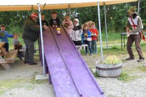 Kids race their handcrafted zucchini cars during the Zucchini Festival at the Homer Farmers Market on Saturday, Aug. 24, 2024, in Homer, Alaska. (Delcenia Cosman/Homer News)