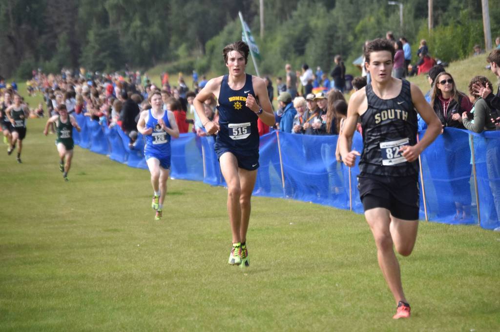 Homers Johannes Bynagle sprints to the finish of the boys varsity race at the Ted McKenney XC Invitational on Saturday, Aug. 24, 2024, at Tsalteshi Trails just outside of Soldotna, Alaska. (Photo by Jeff Helminiak/Peninsula Clarion)