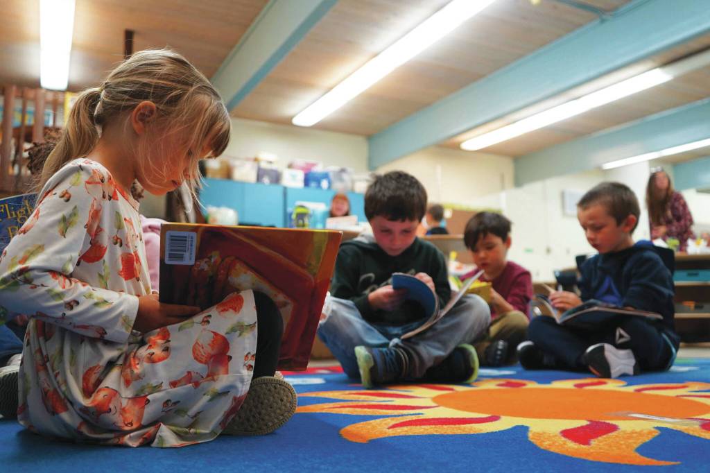 Jake Dye/Peninsula Clarion
Students sit down to read books on the first day of the school year at Tustumena Elementary School in Kasilof on Wednesday.