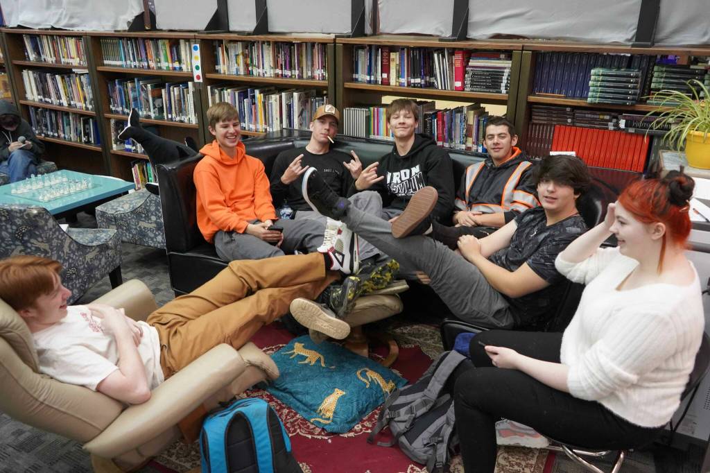 Students sit together during a break period on the first day of the school year at River City Academy near Soldotna, Alaska, on Wednesday, Aug. 21, 2024. (Jake Dye/Peninsula Clarion)