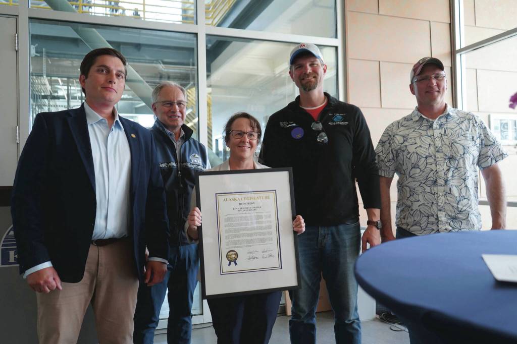 Kenai Peninsula College Director Cheryl Siemers, center, and University of Alaska Anchorage Chancellor Sean Parnell, center left, receive a legislative citation on behalf of KPC in recognition of the college's 60th anniversary presented by Rep. Justin Ruffridge, Sen. Jesse Bjorkman and Rep. Ben Carpenter during a celebration of that anniversary at Kenai Peninsula College in Soldotna, Alaska, on Tuesday, Aug. 20, 2024. (Jake Dye/Peninsula Clarion)